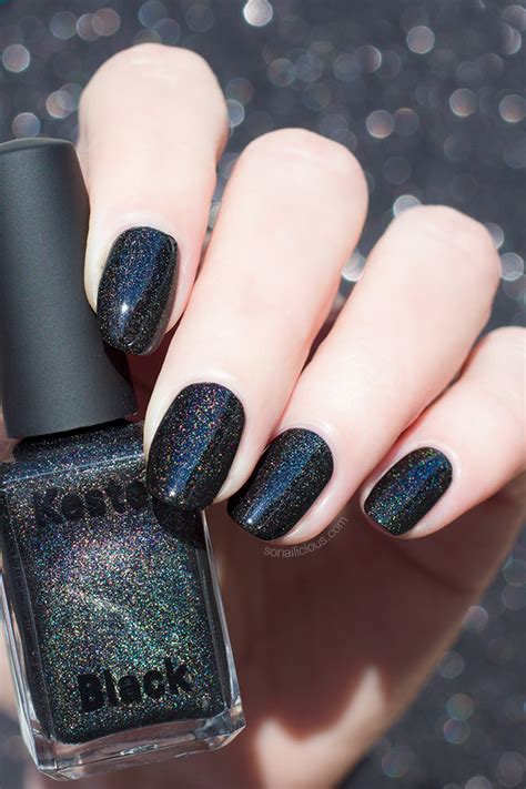 holographic nail polish over black.